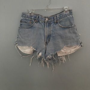Levi's 550 light wash distressed denim shorts.
